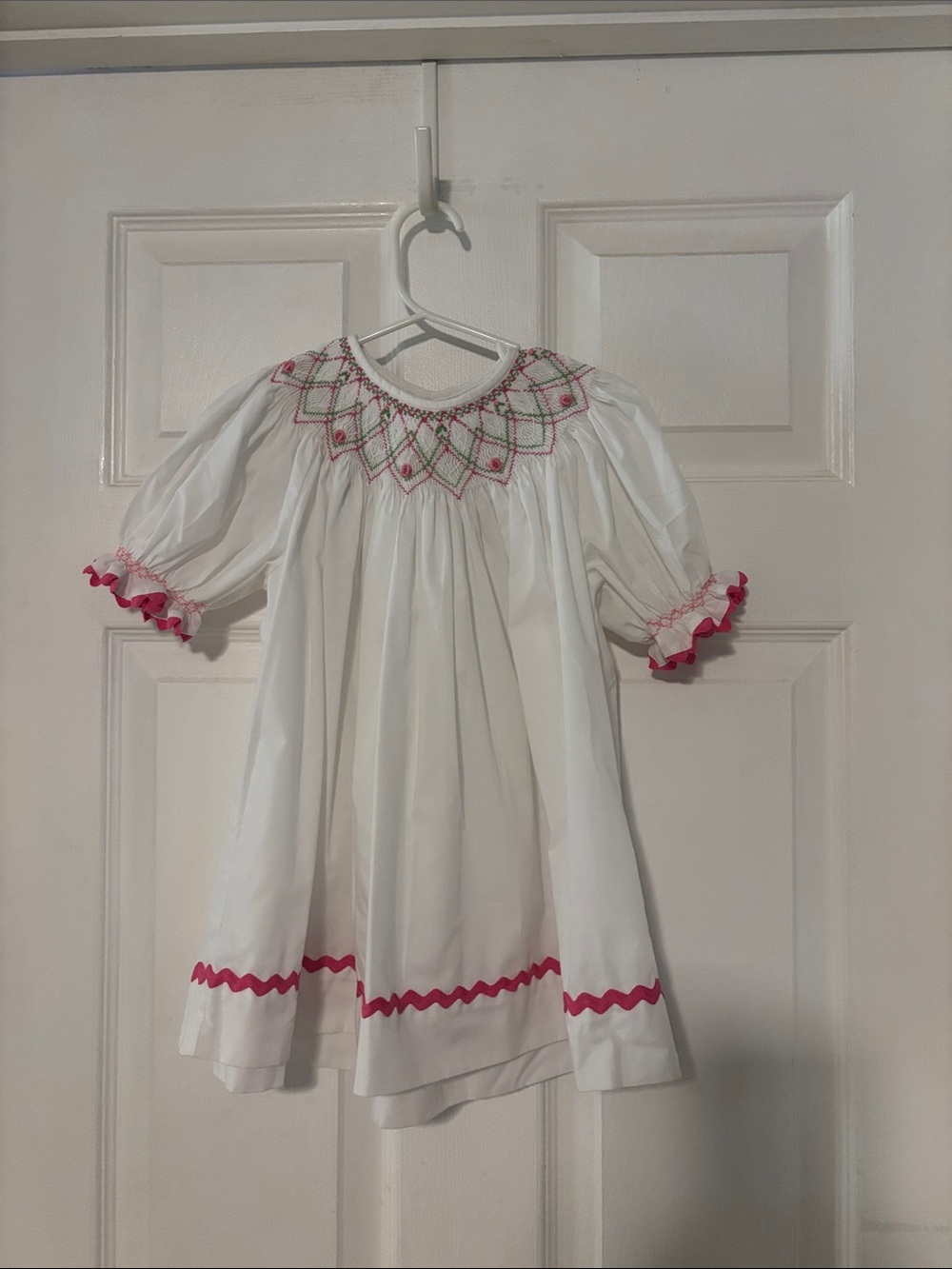 White Girls' Smocked shirt (or dress)  with Pink Trim and Embroidery. So cute!